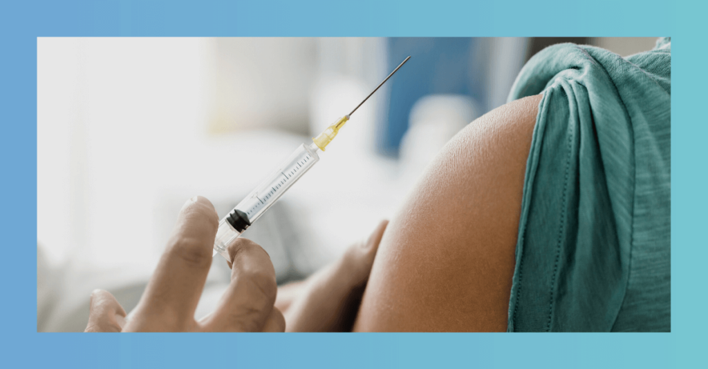 Healthcare professional preparing vaccine injection for patient