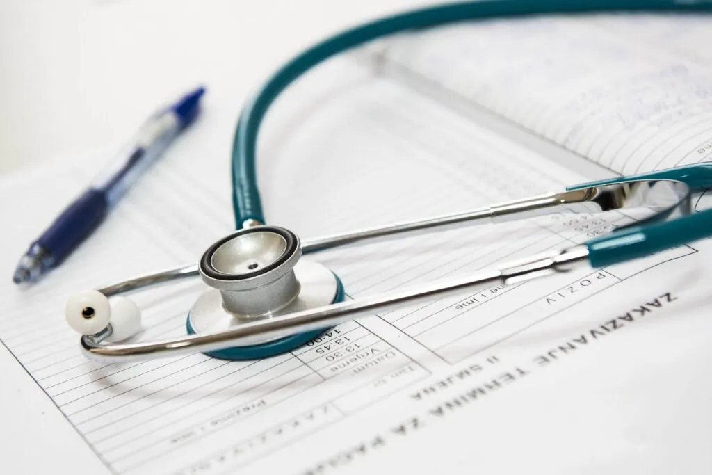 Stethoscope and medical paperwork on healthcare administrative form