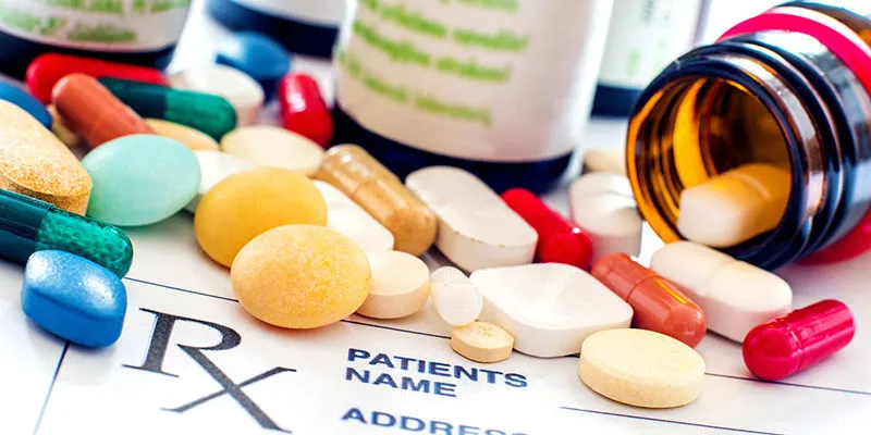 Prescription medications and pills on medical prescription form