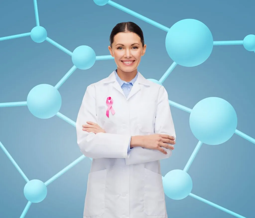 Female healthcare professional with breast cancer awareness ribbon