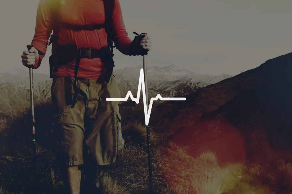 Hiker outdoors with heartbeat wellness and active lifestyle concept