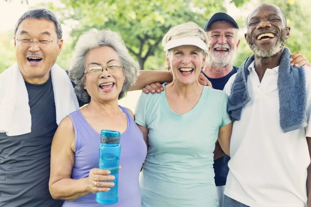Diverse senior adults participating in outdoor wellness and fitness activity